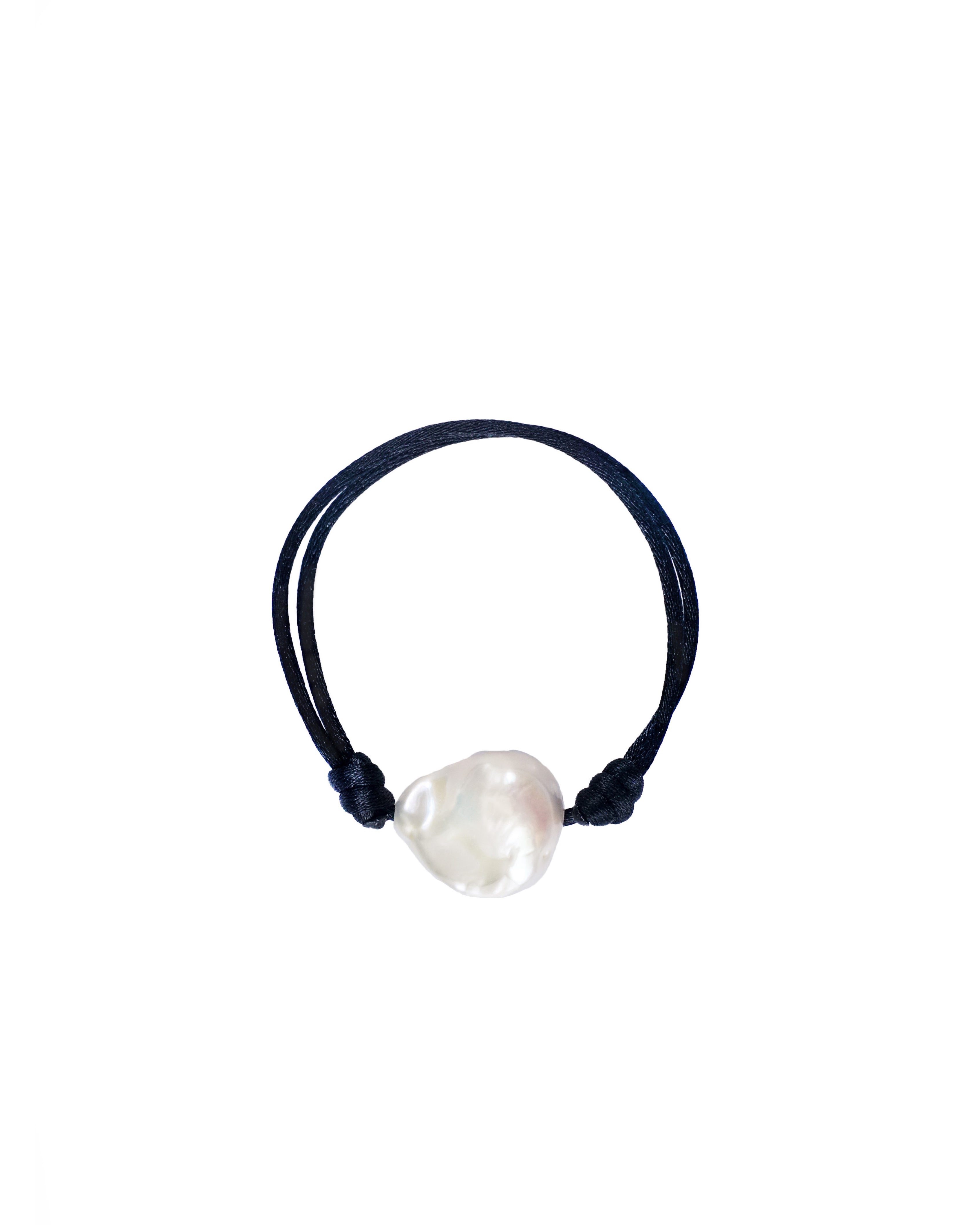 A baroque pearl bracelet with an adjustable silk thread in black.