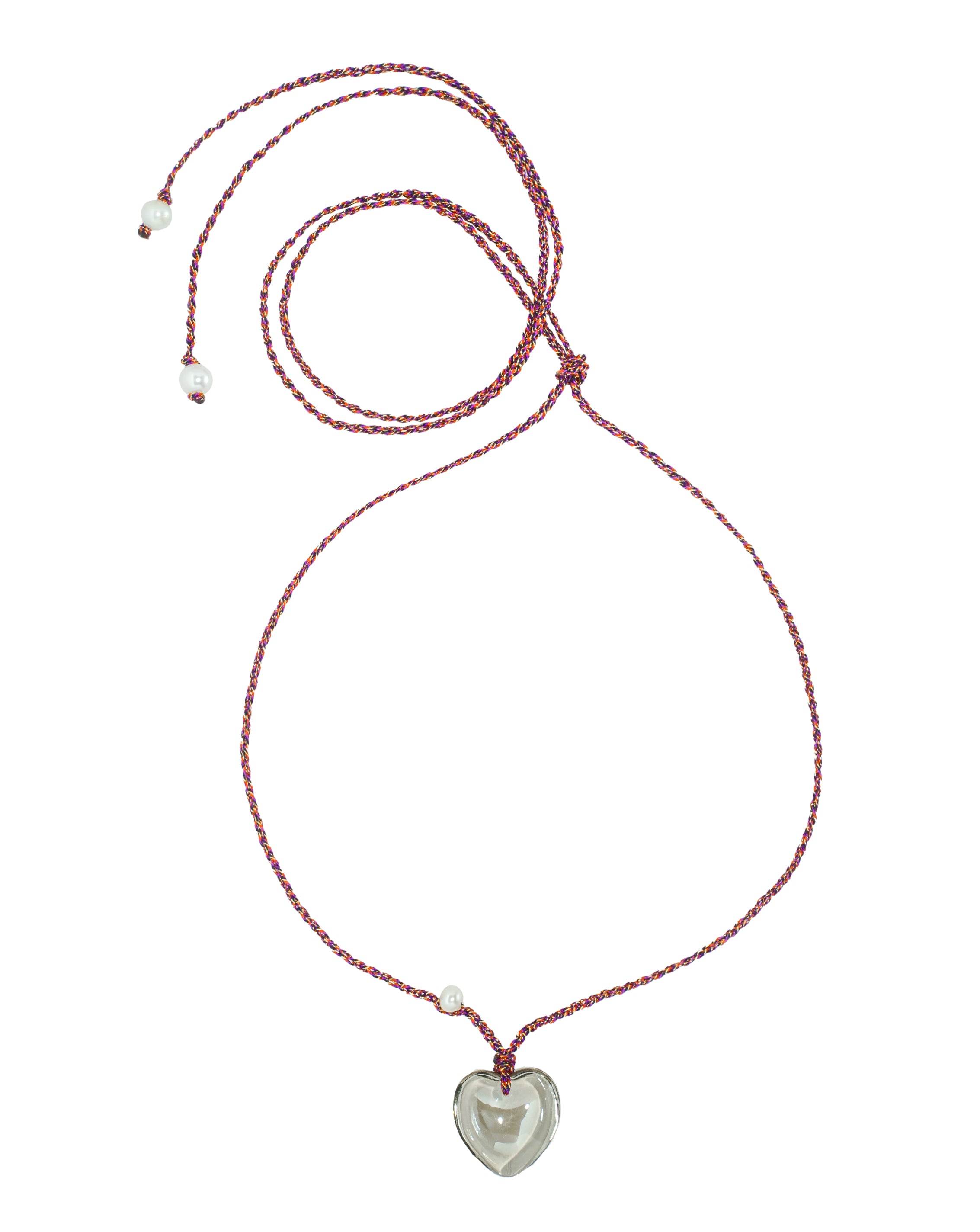 A glass heart necklace with freshwater pearls, displayed on a red thread.