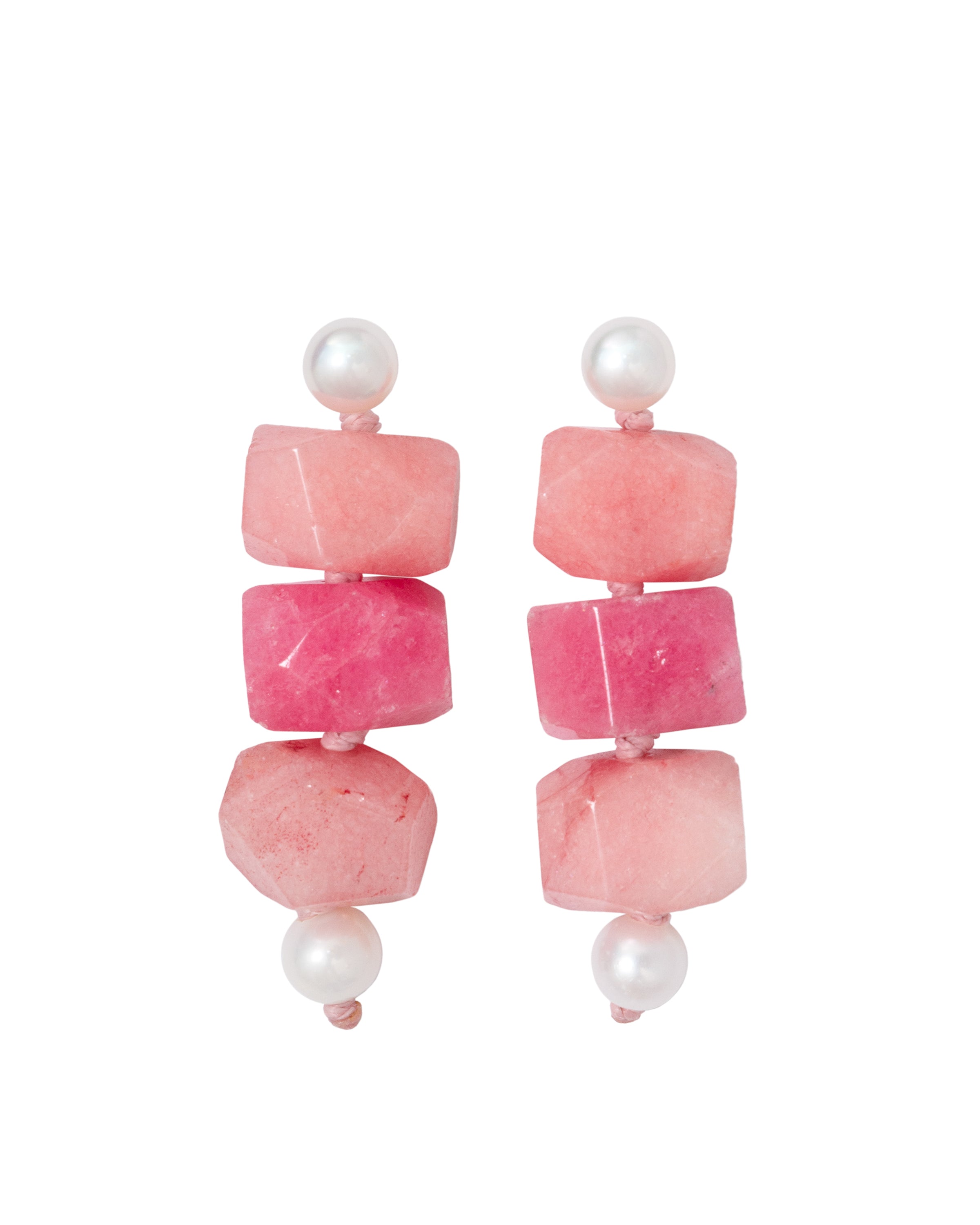 A pair of pink jade stone earrings with freshwater pearl studs, suspended from the ear.