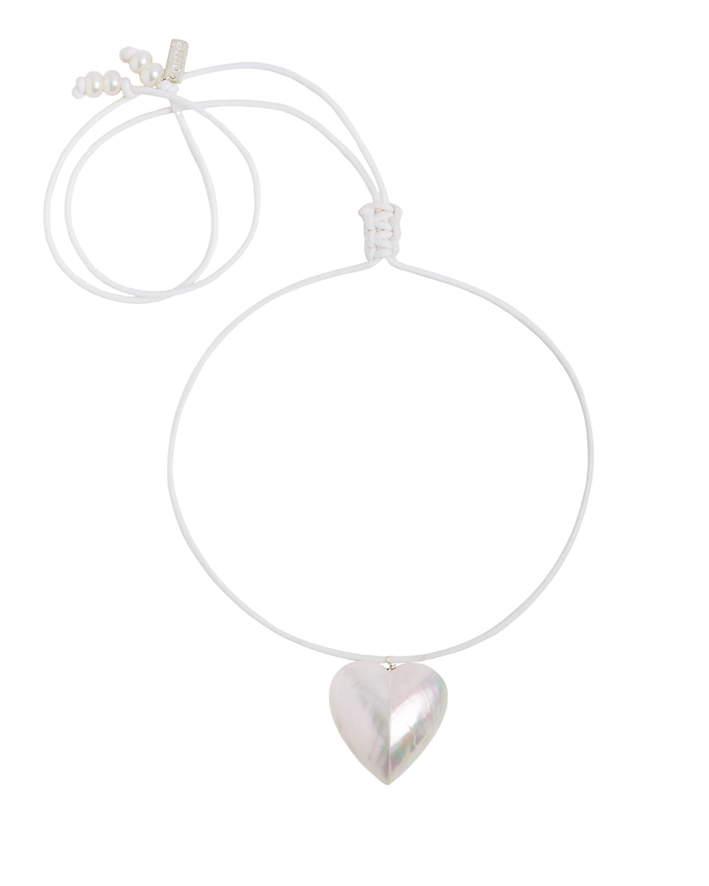 A white waxed cotton cord necklace with a large shell heart pendant and freshwater pearls.