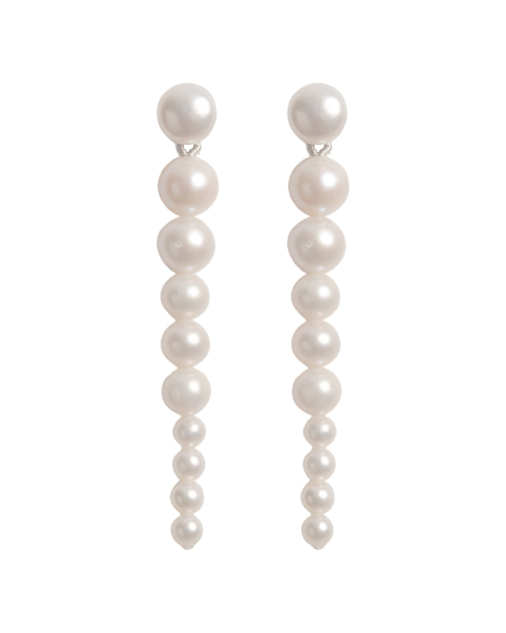 A pair of round freshwater pearl earrings with a graduated design, set in silver-colored hoops.